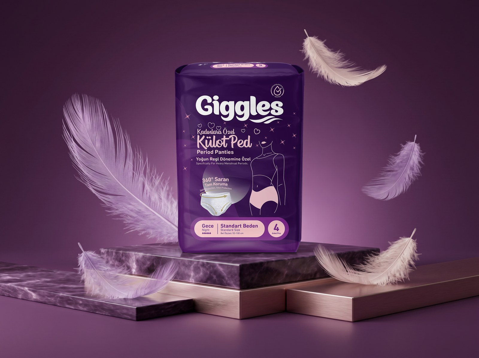 Mermer platform üzerinde duran Giggles Külot Ped paketi